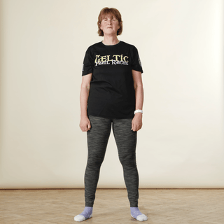 A video of a woman demonstrating a squat without weights