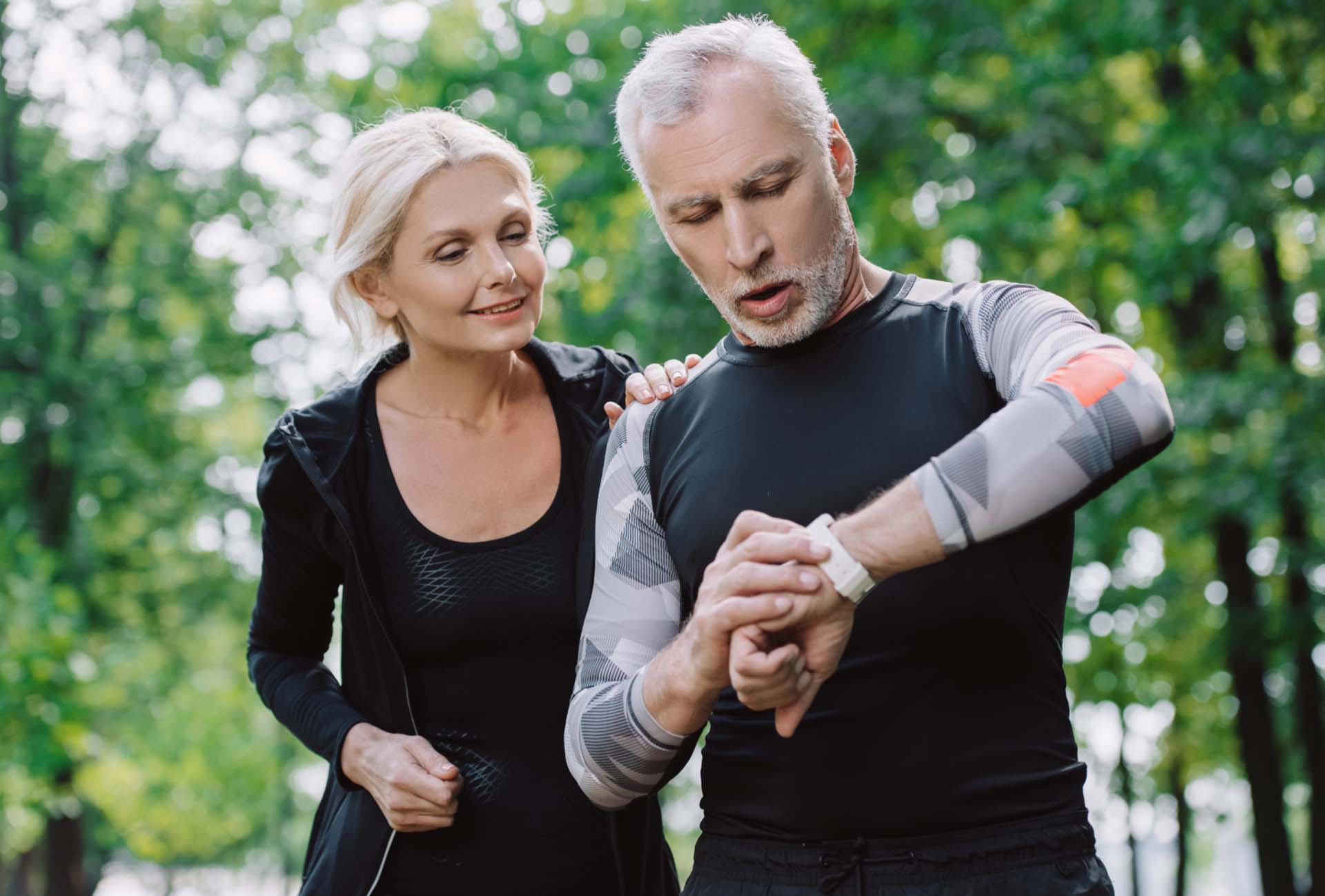 Couple checking an fitness tracker