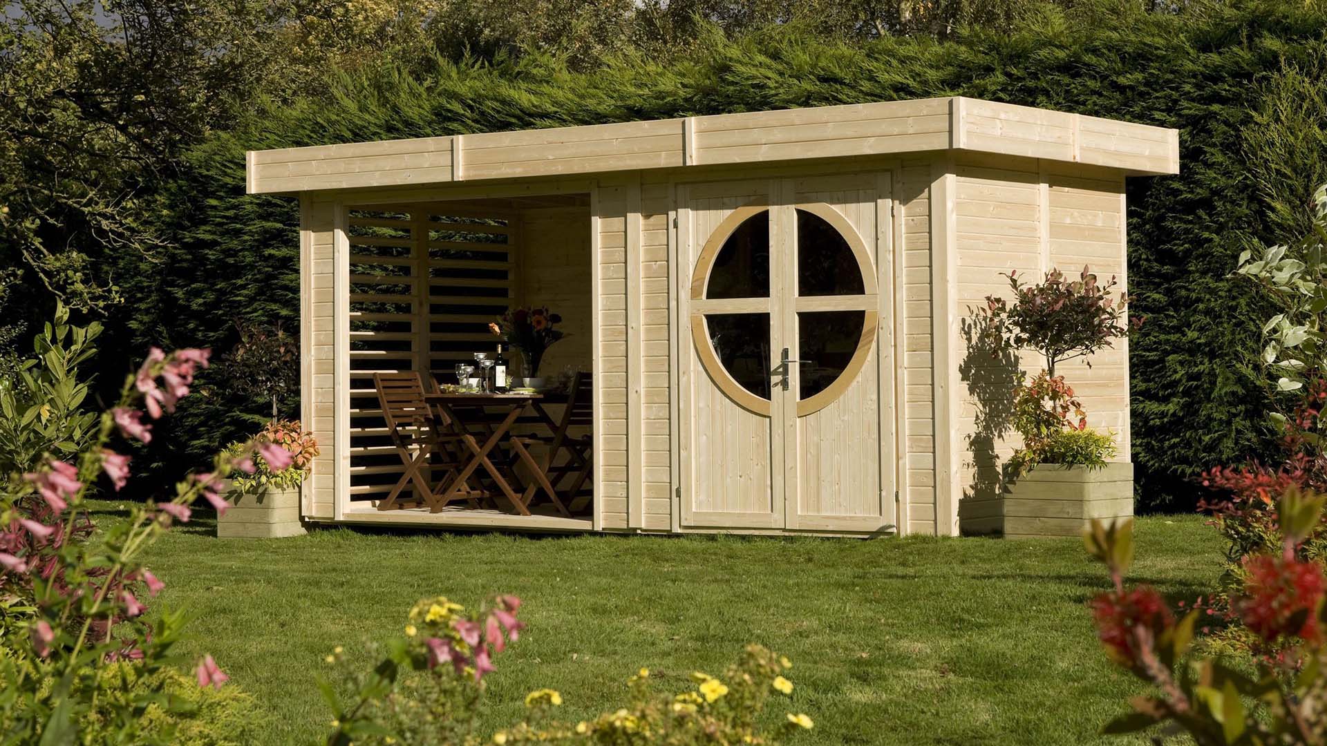 A wooden garden cabin with a large floor-to-ceiling window and round window