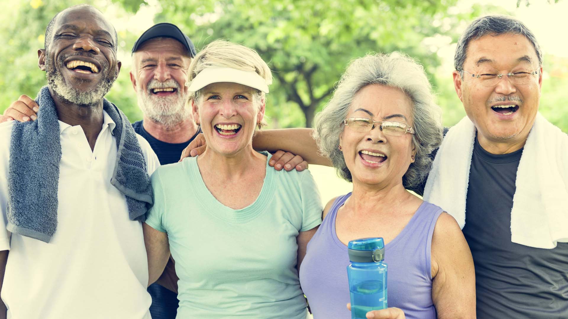Group of people smiling after a run outside.