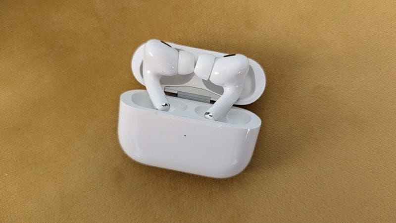 Apple AirPods in their case