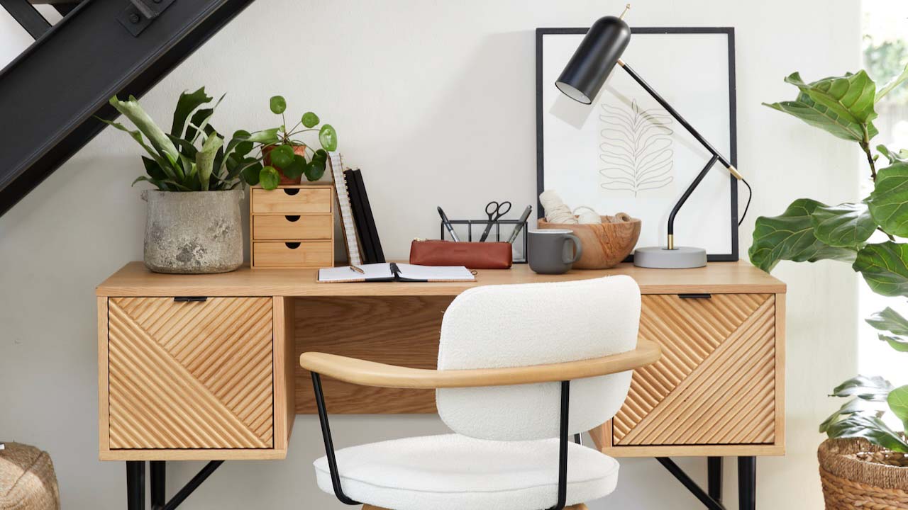 Designer desk and chair with a table lamp