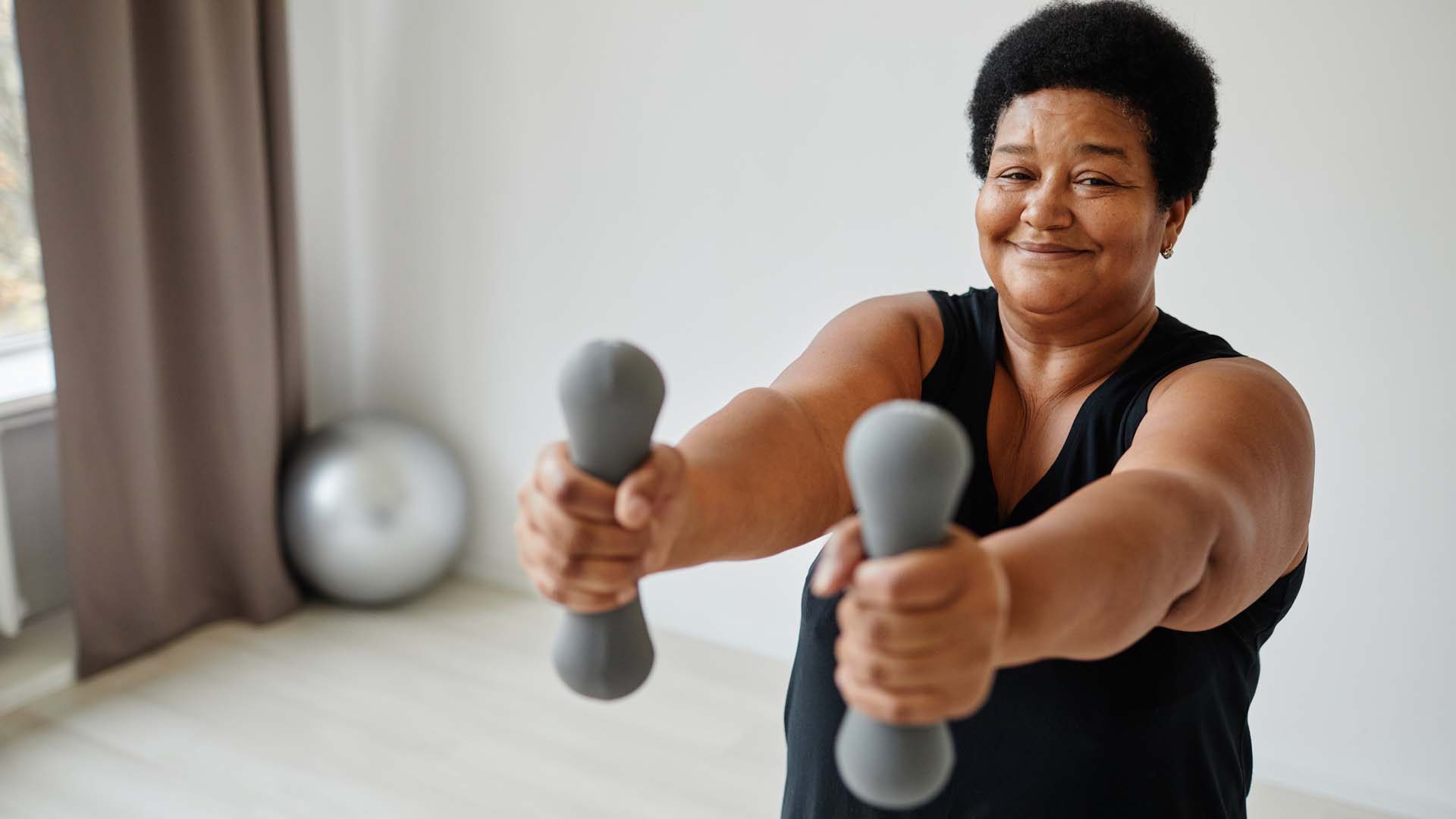 lady holding hand weights
