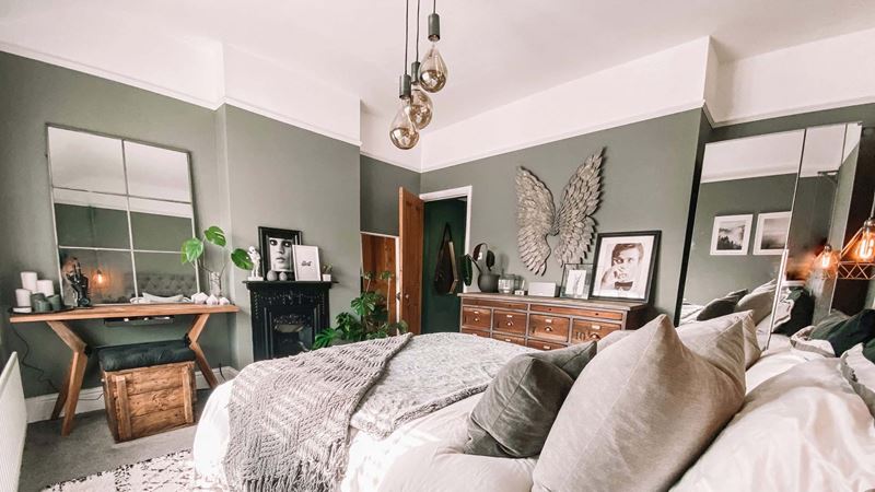 a spare room being used as an office with several mirrors