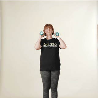 woman demonstrating an overhead shoulder press