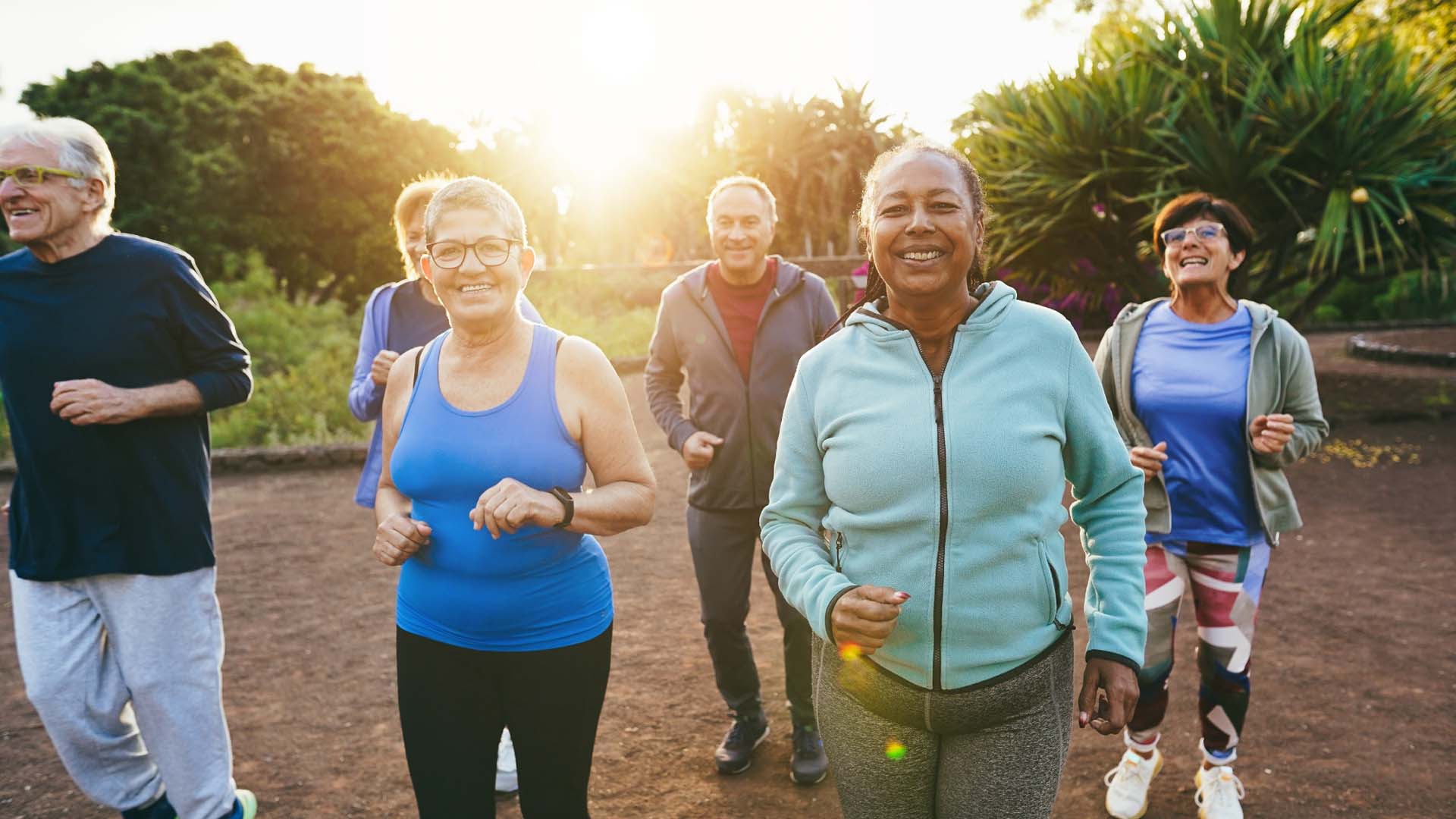 Group of older men and women running