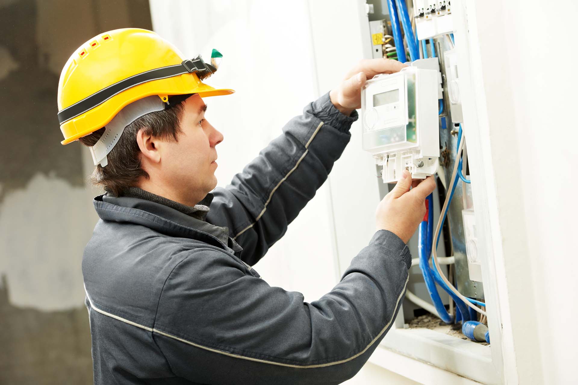 electrician fitting a smart meter
