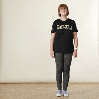 A woman demonstrating a side lunge