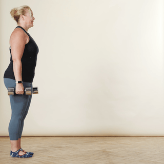 walking lunge with dumbbells across a room