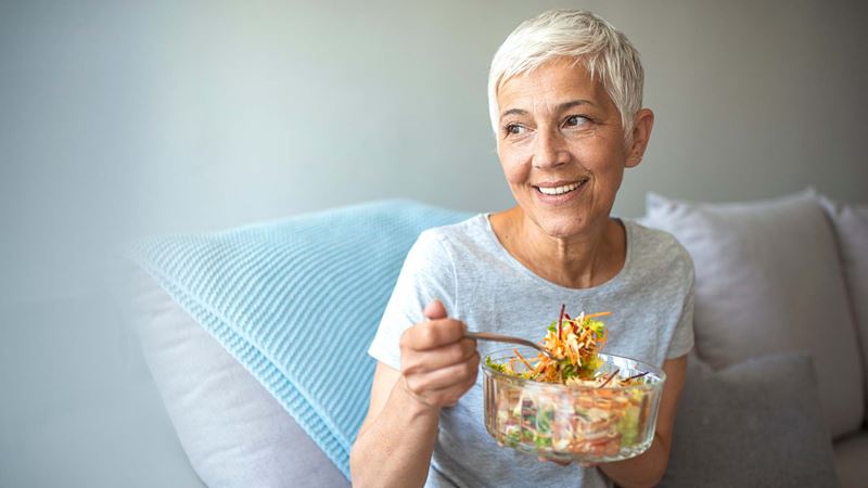 Eating from a bowl of salad