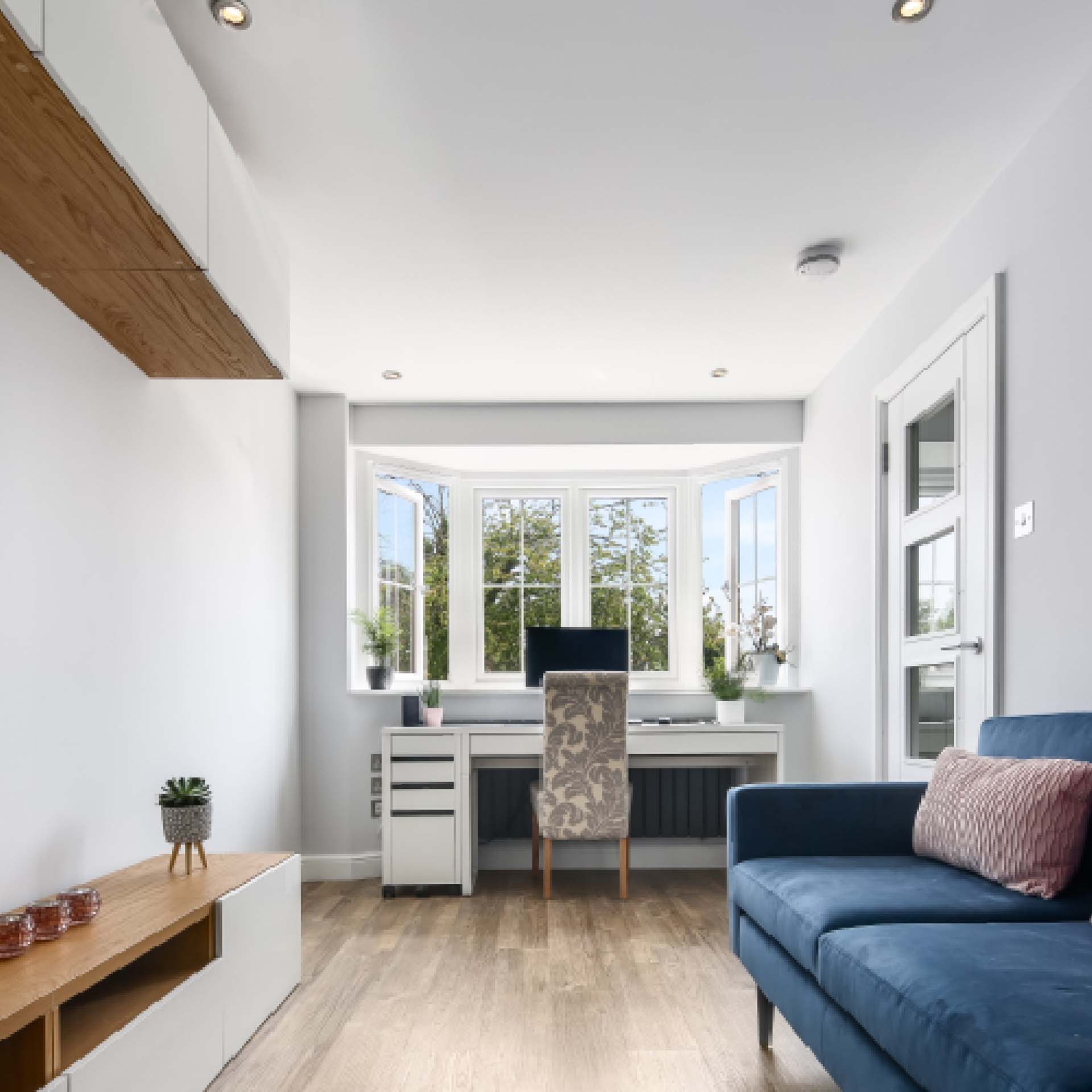 sleek white home office in a converted garage