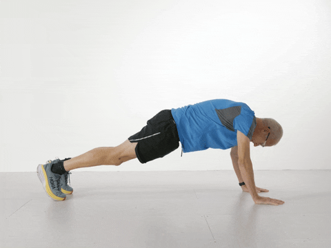 Paul in the press-up position but raising one leg