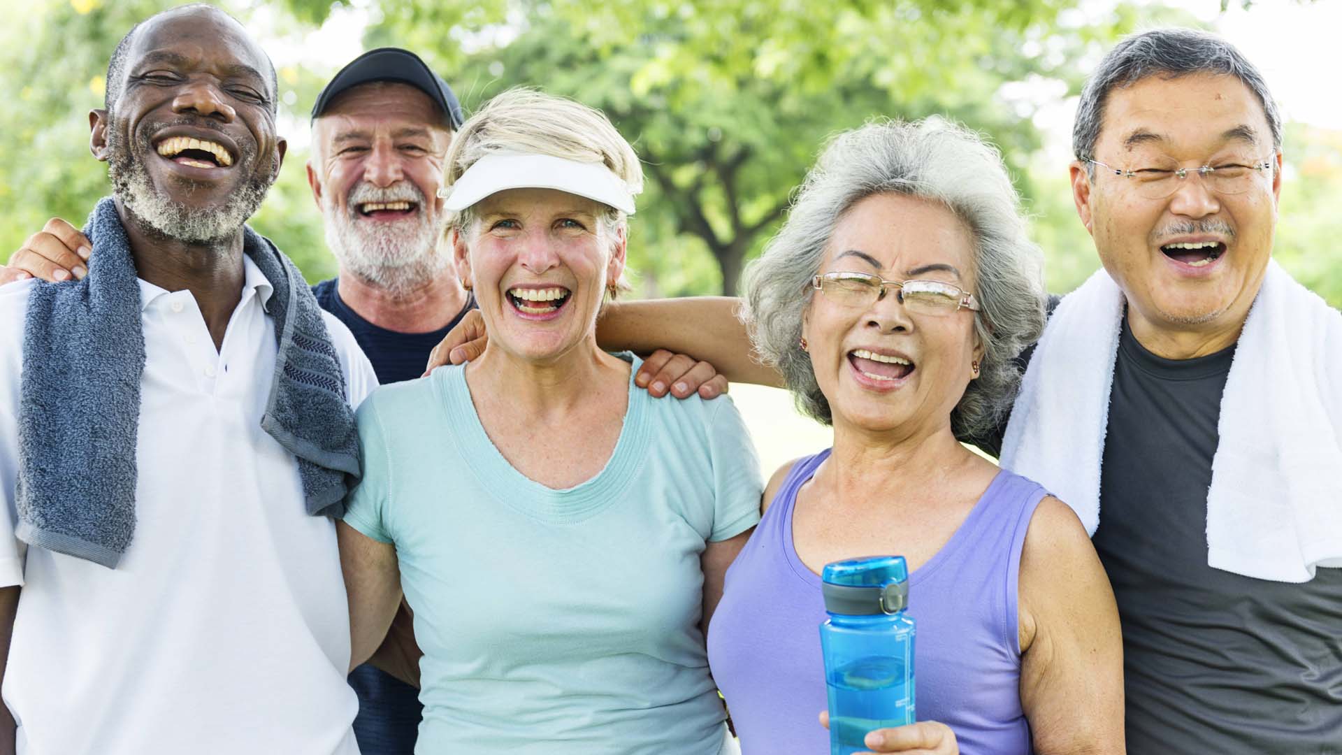 A group of people in exercise clothing looking happy and smiling