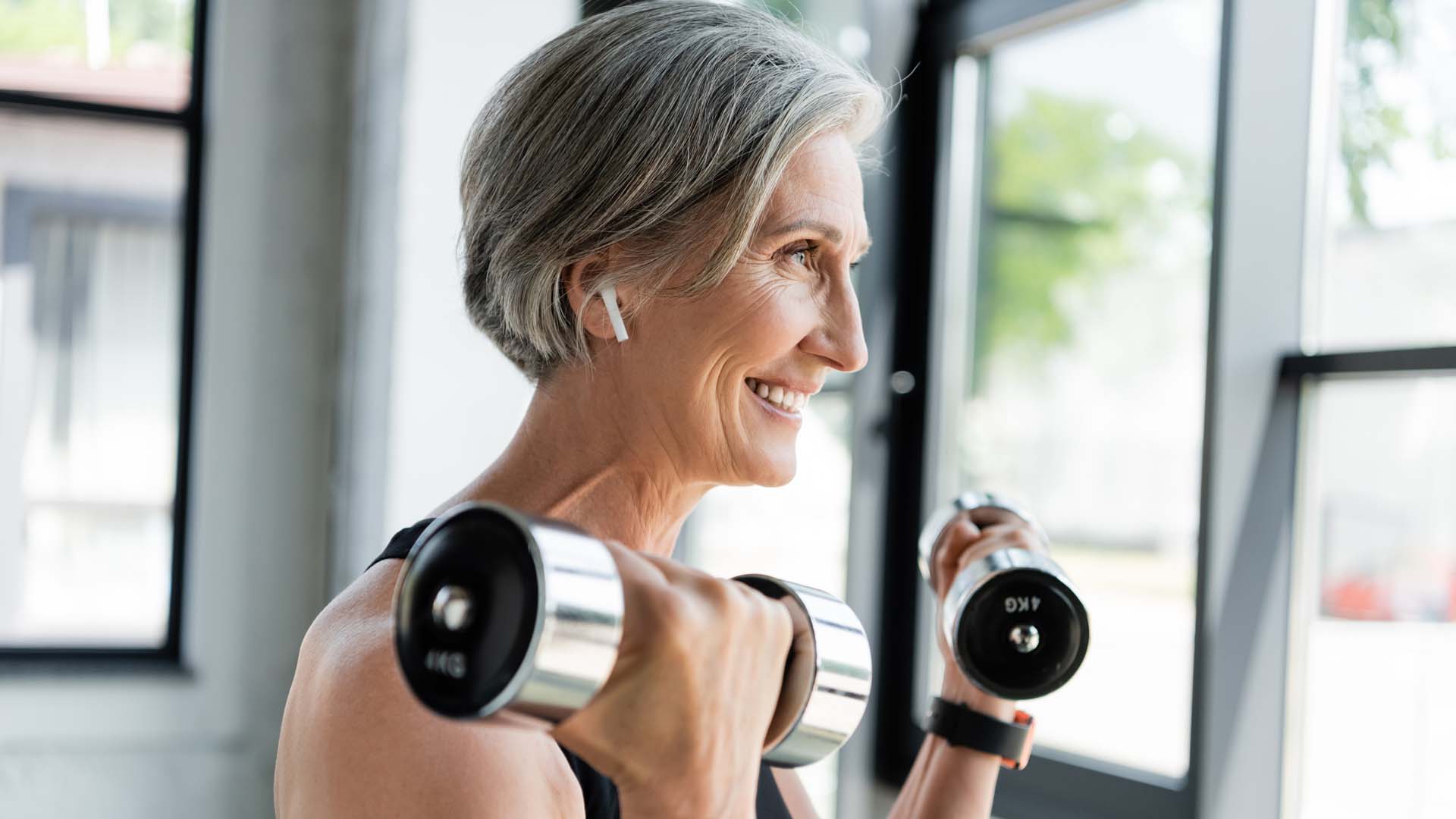 woman with two dumbells