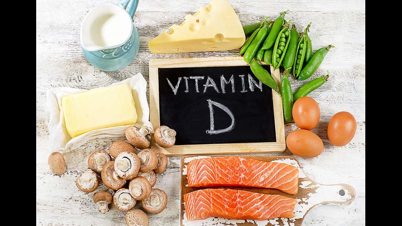 A blackboard saying Vitamin D surrounded by food which is rich in it