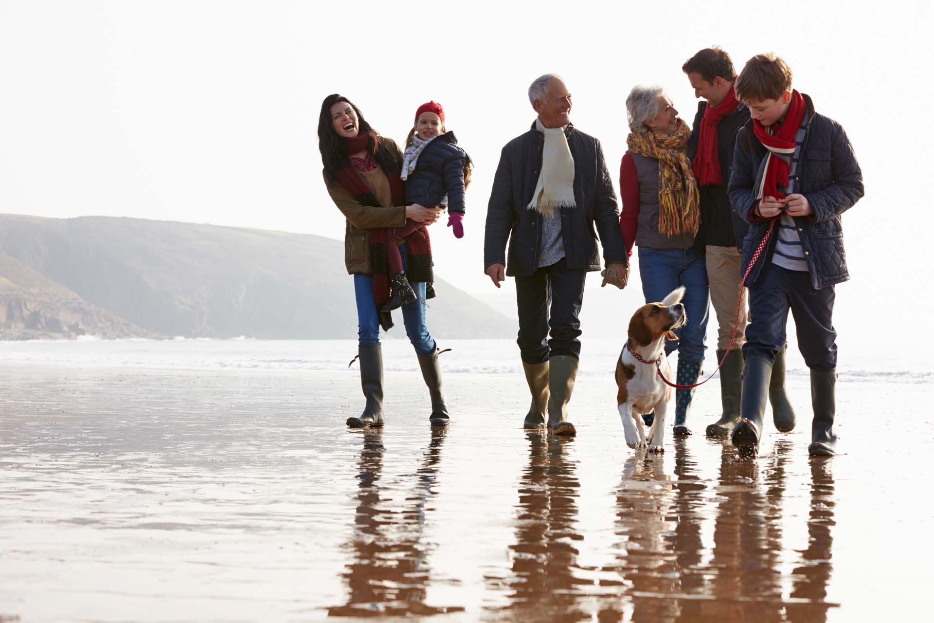 family walking on the beach