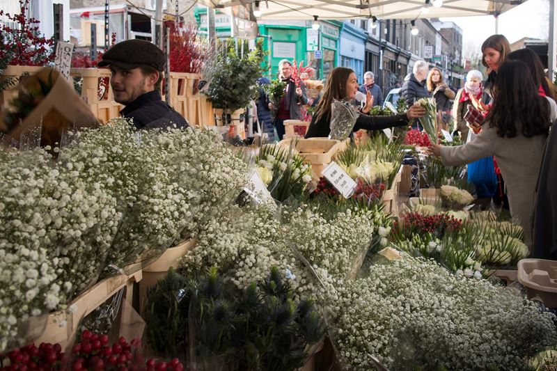 A market stall selling bunches of gypsophila