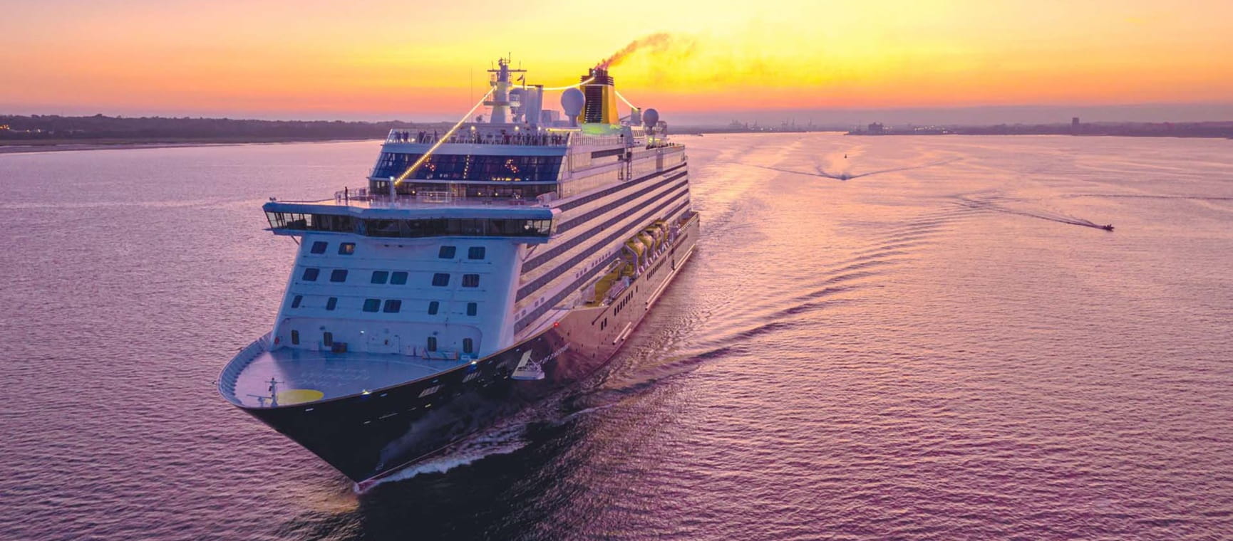 The Spirit of Discovery sailing at sunset