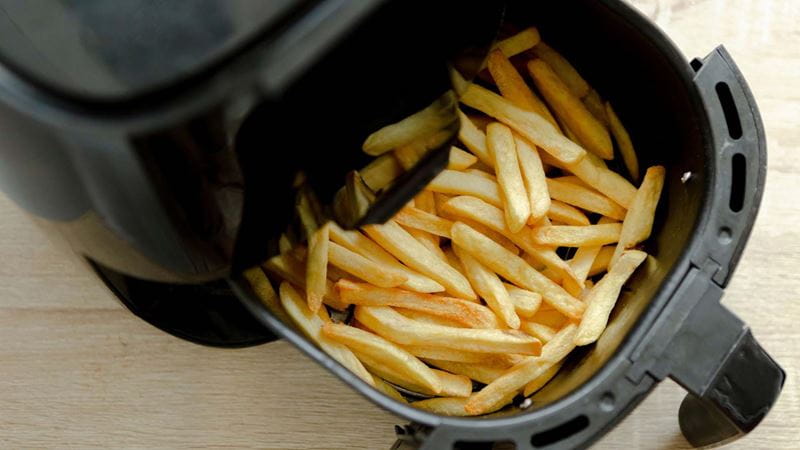 Chips being cooked in an air fryer