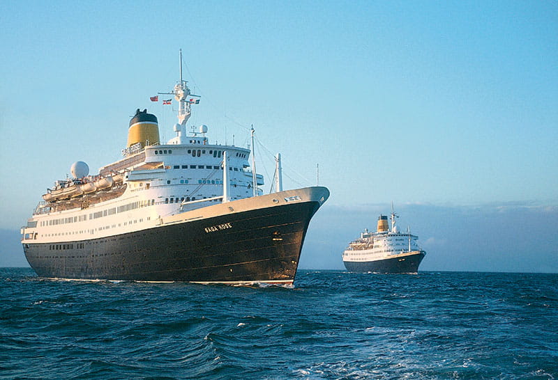 The cruise ship Saga Rose at sea with a tug boat