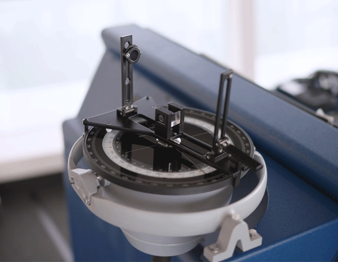 Close-up of a metal engineering component secured in a testing or machining device