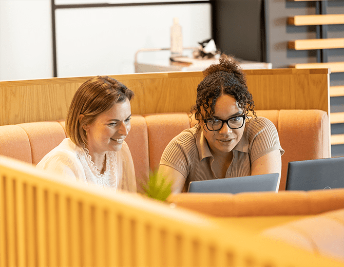 Two sitting colleagues at meeting