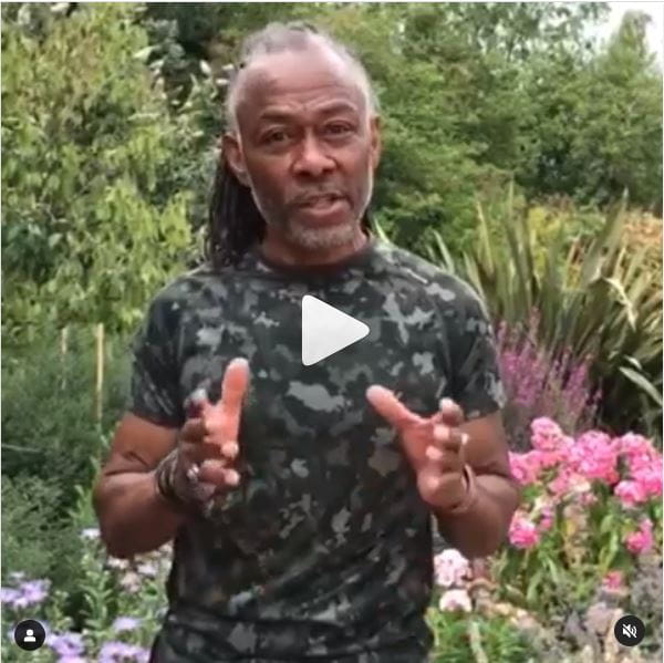 Danny Clarke in a garden talking