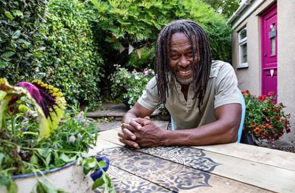 Danny Clarke sitting at a garden table