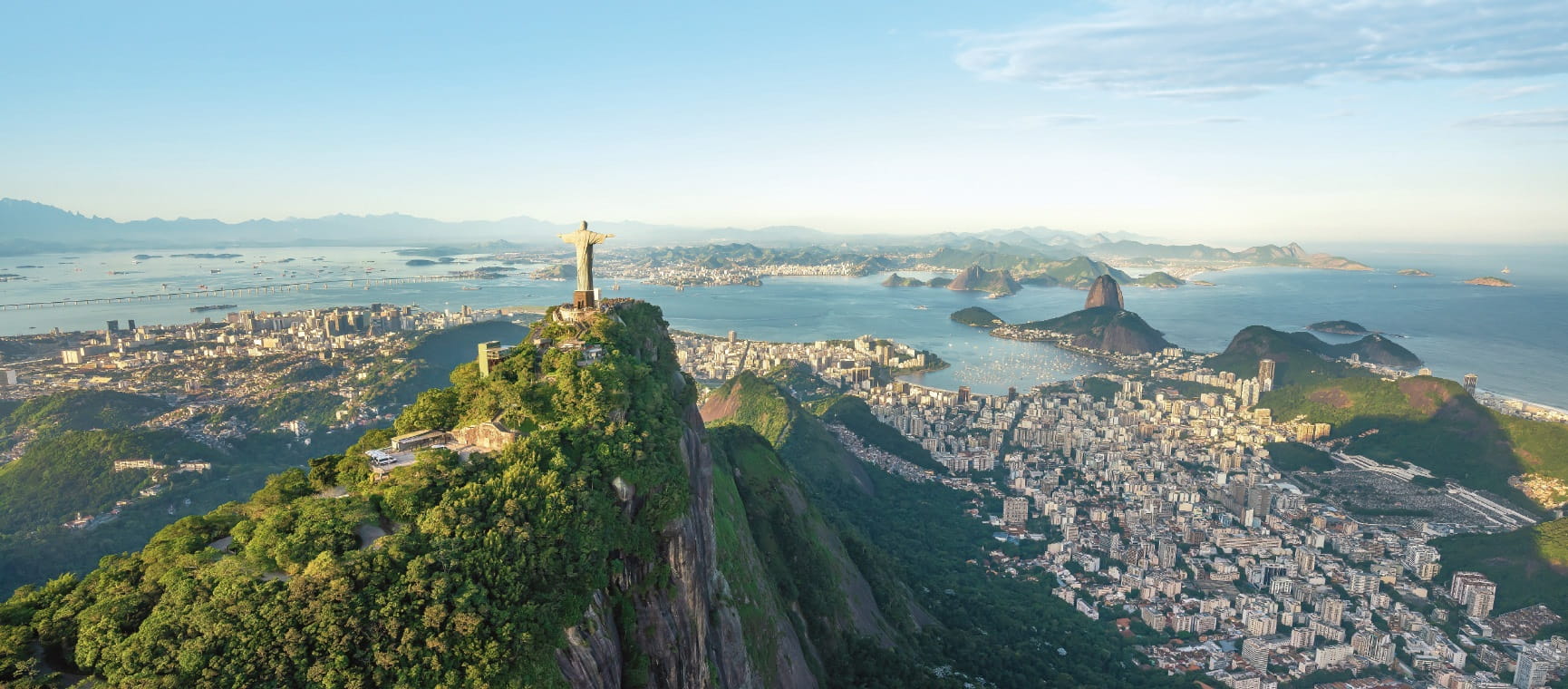 Aerial view of Rio de Janeiro with Christ the Redeemer statue overlooking the city and coastline