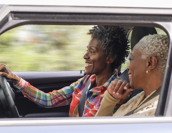 Two people driving in a car