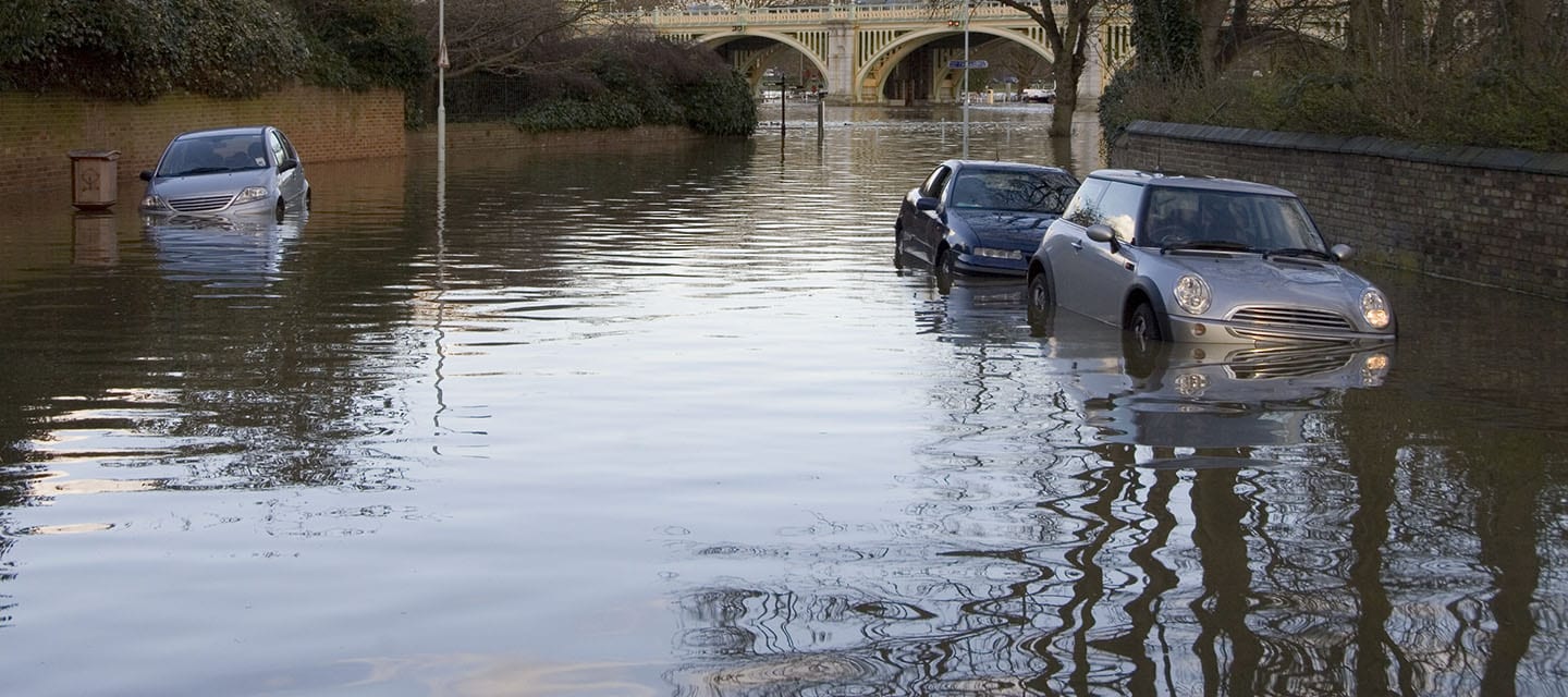 A Spring high tide floods a Richmond street leaving cars waterlogged.