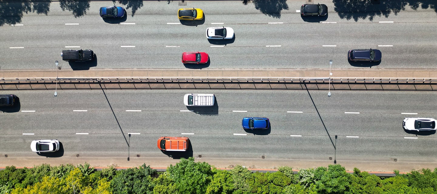 Overhead aerial view of moving traffic on a highway