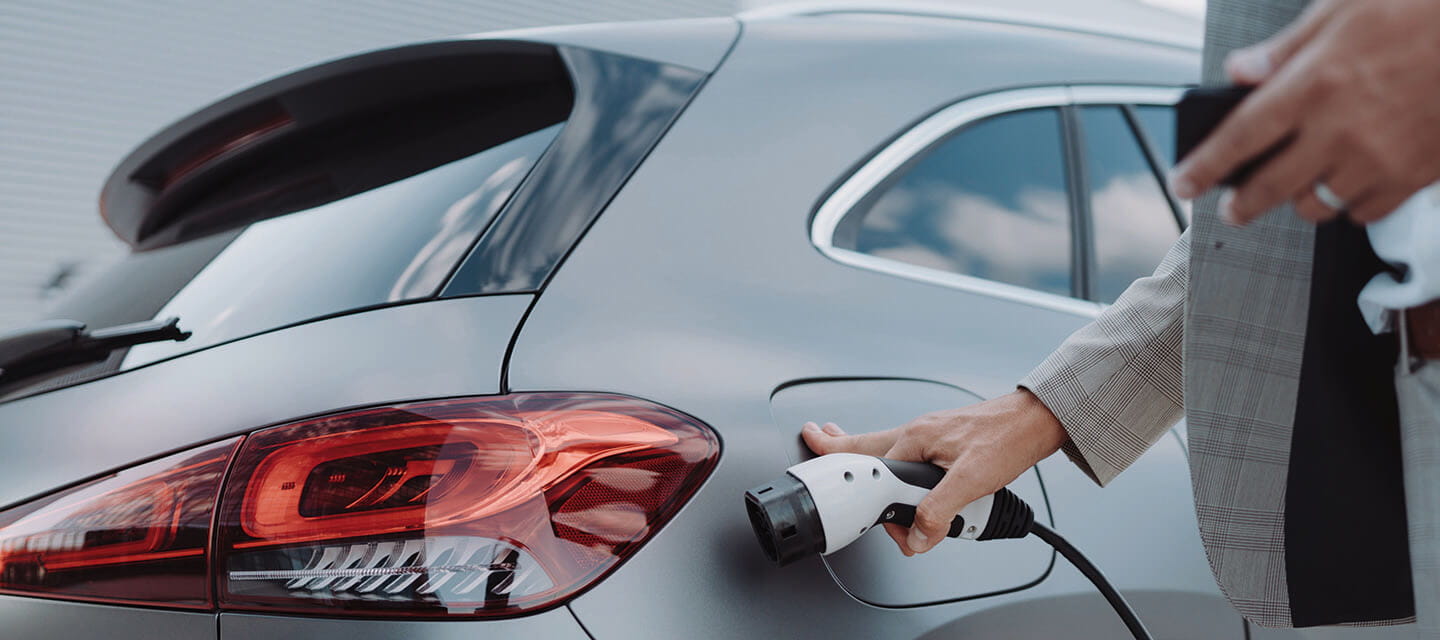 Close up of a car charger about to be plugged in