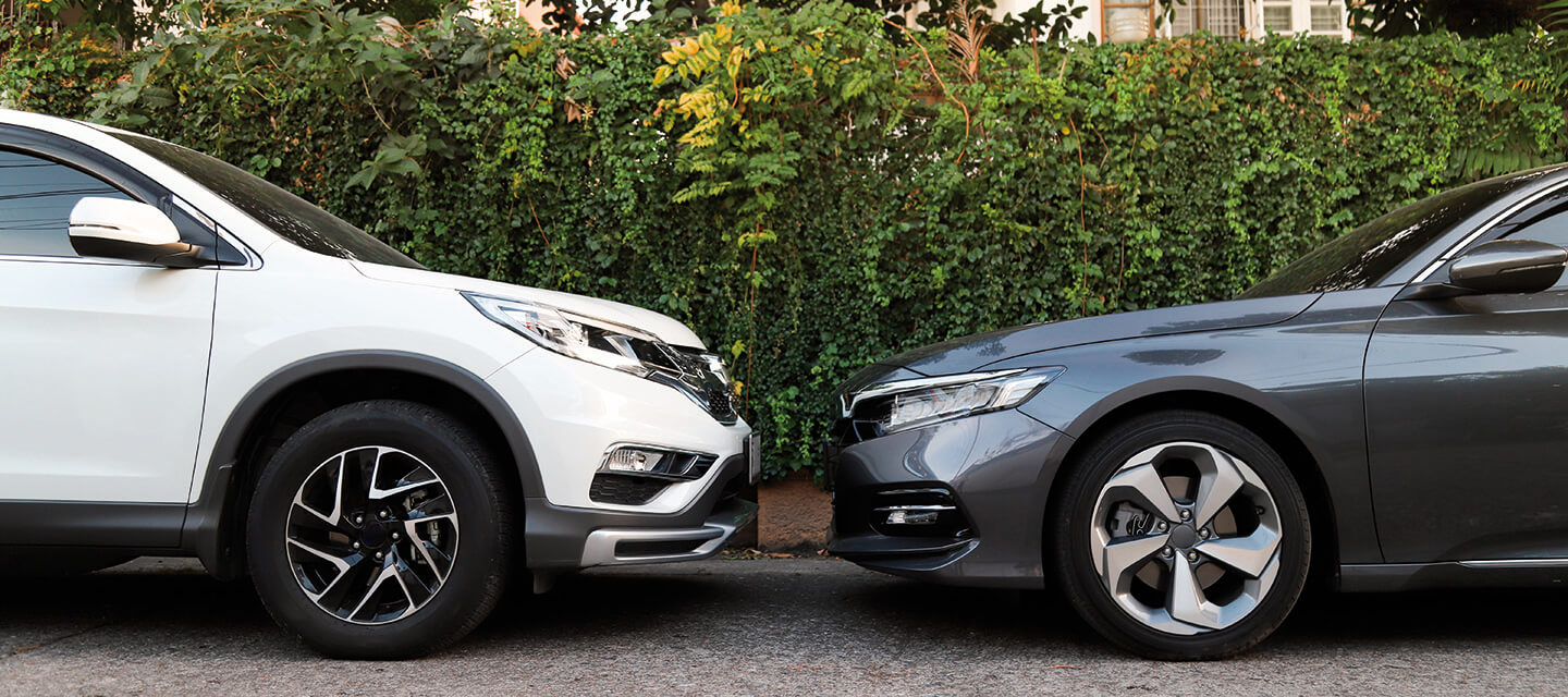 Two cars parked facing each other