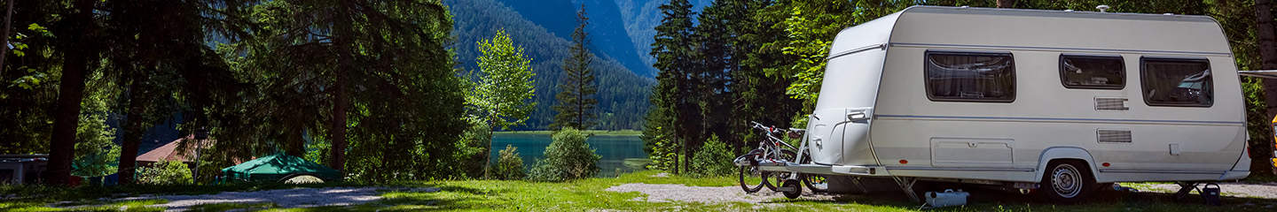 A caravan in a beautiful Italian campsite on a hot day