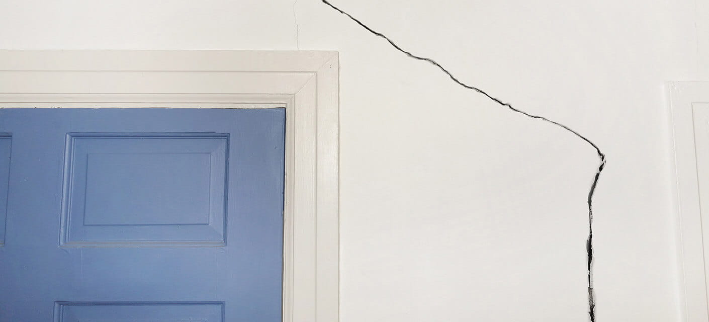 A crack running along a wall at home