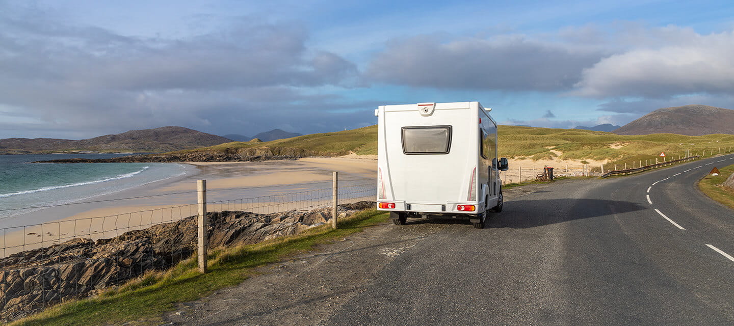 Motorhome parked overlooking the view from the road across the Isle of Harris, Scotland.