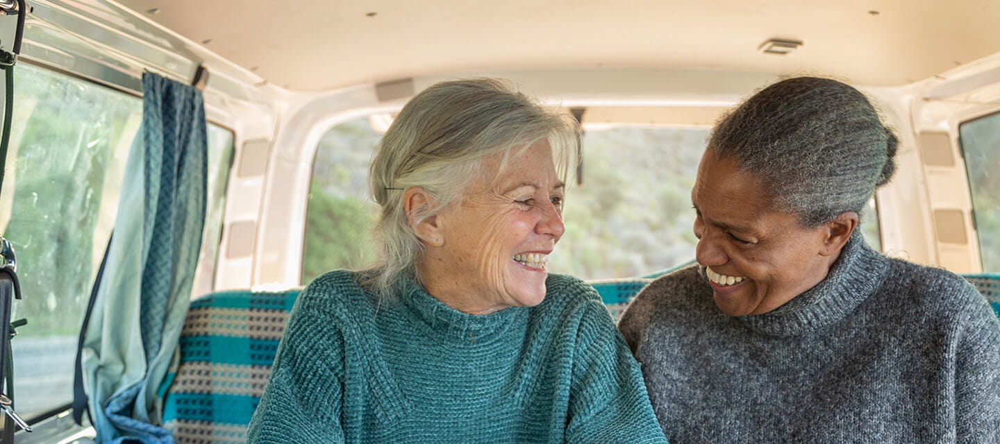 Friends enjoying time together in their camper van.