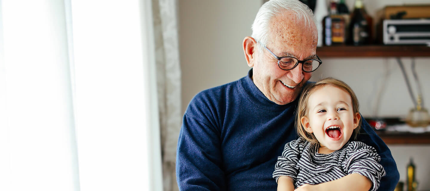 A grandfather with his happy grandchild