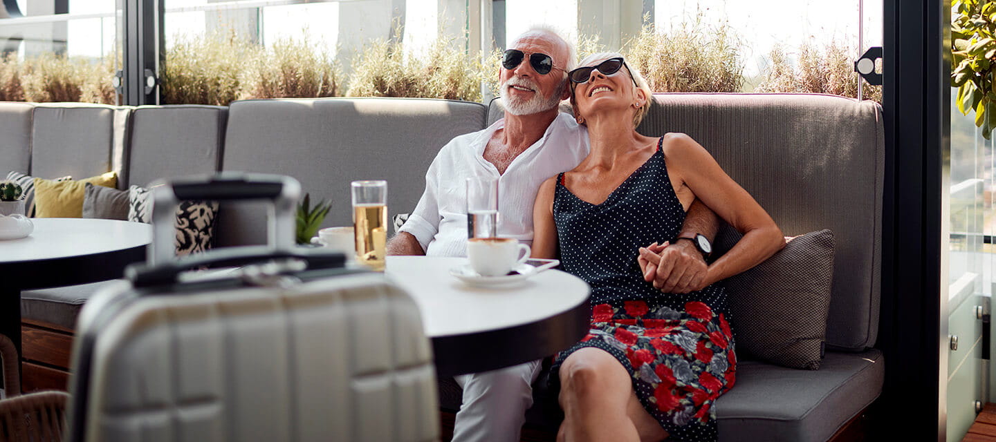 Senior couple having a break in the hotel restaurant while on holiday.