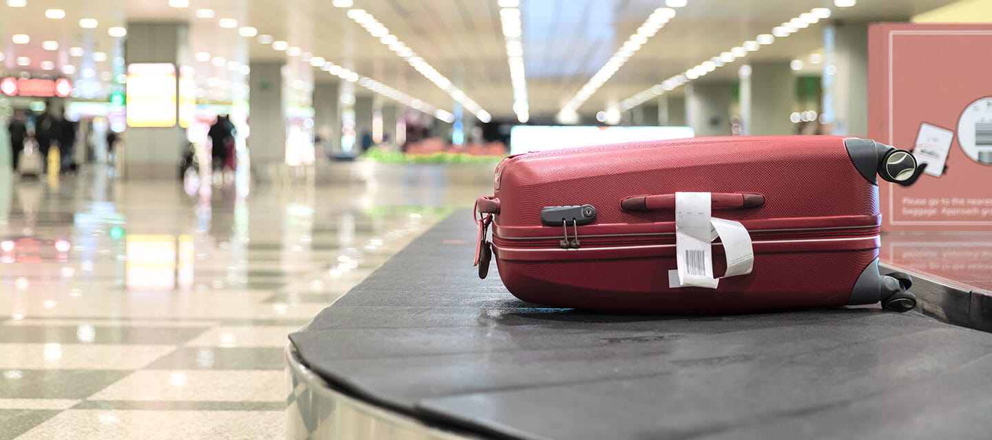 Luggage On Conveyor Belt At Airport