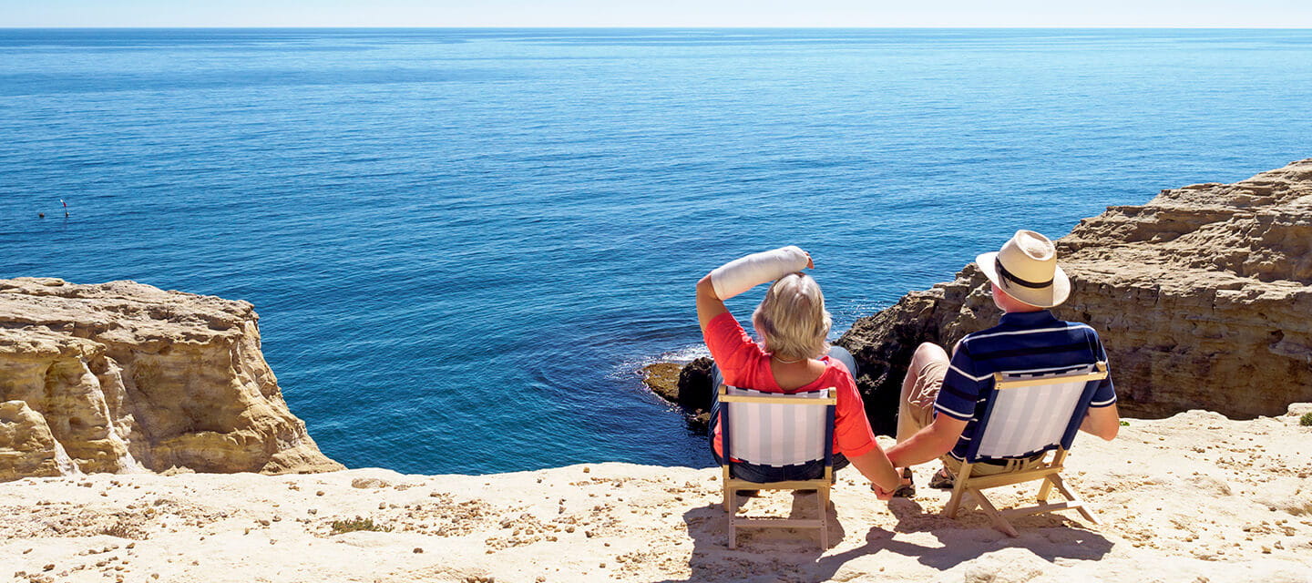 Spain, Andalusia, Cabo de Gata, back view of couple looking at the sea 