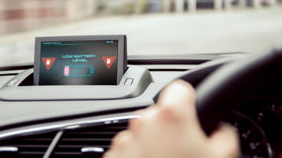 Electric car dashboard screen showing low battery