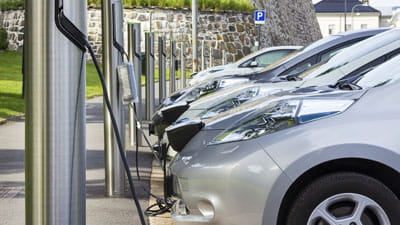 Electric cars charging on the street