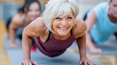 A mature woman enjoying a yoga class