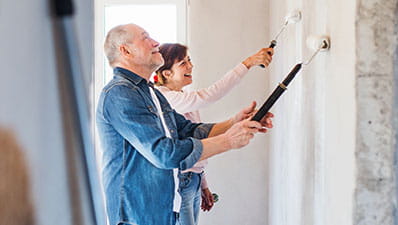 A couple decorating their home