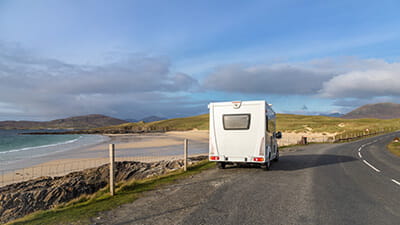 Motorhome parked overlooking the view from the road across the Isle of Harris, Scotland.