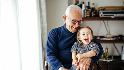 A grandfather with his happy grandchild