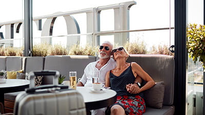 Senior couple having a break in the hotel restaurant while on holiday.