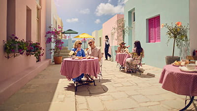 A mature couple dining alfresco on a beautiful sunny day while on holiday. 